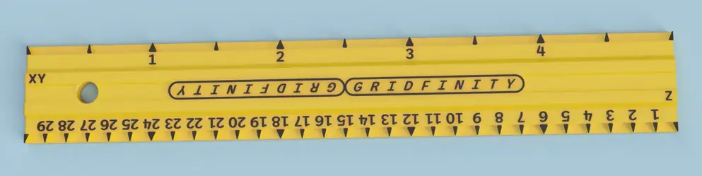 A ruler, but with markings for Gridfinity units (as well as half-units on one side and sixths on the other). Five units long.